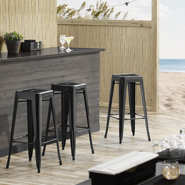 Lancaster Table & Seating Alloy Series Black Stackable Metal Indoor / Outdoor Industrial Barstool wi